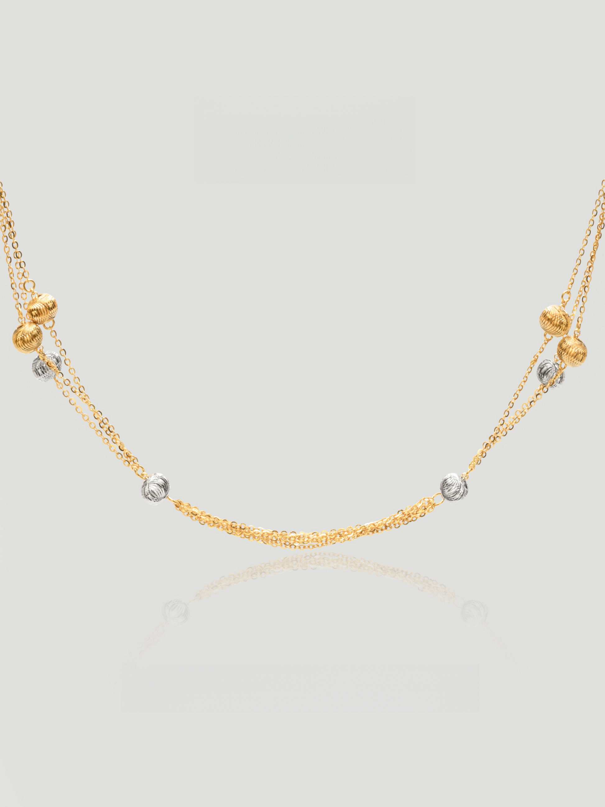 CARV. gold layered bead necklace with silver bead accents and double chain design