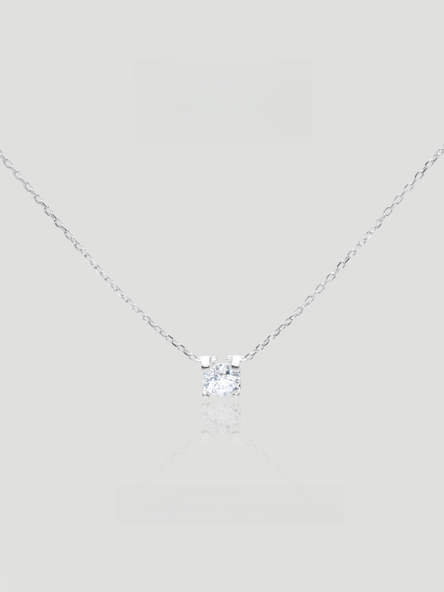 CARV. silver solitaire necklace with clear crystal pendant, square setting and fine chain