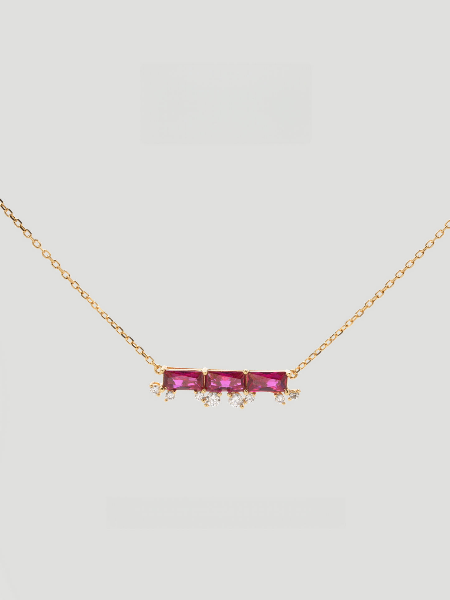 CARV. ruby bar necklace with gold chain, horizontal pink stone bar and small crystal drop accents