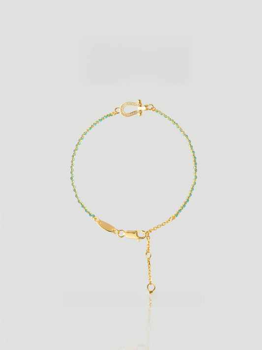CARV. turquoise beaded bracelet with gold bar accent, fine chain and adjustable drop detail