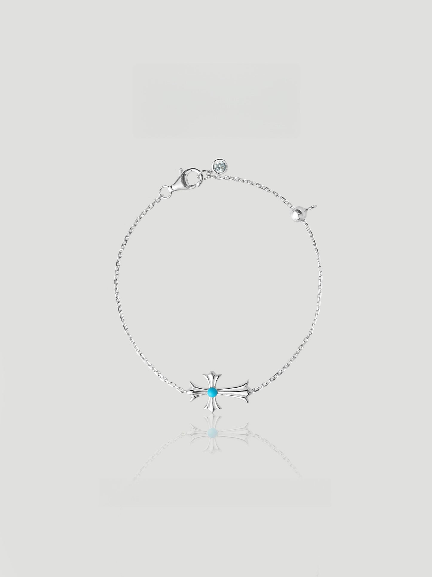 CARV. silver cross bracelet with turquoise centre accent, fine chain and small round charm