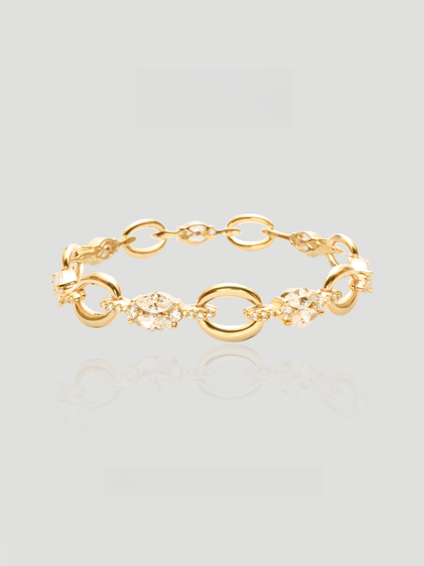 CARV. gold link bracelet with oval links, marquise crystal accents and delicate chain detail