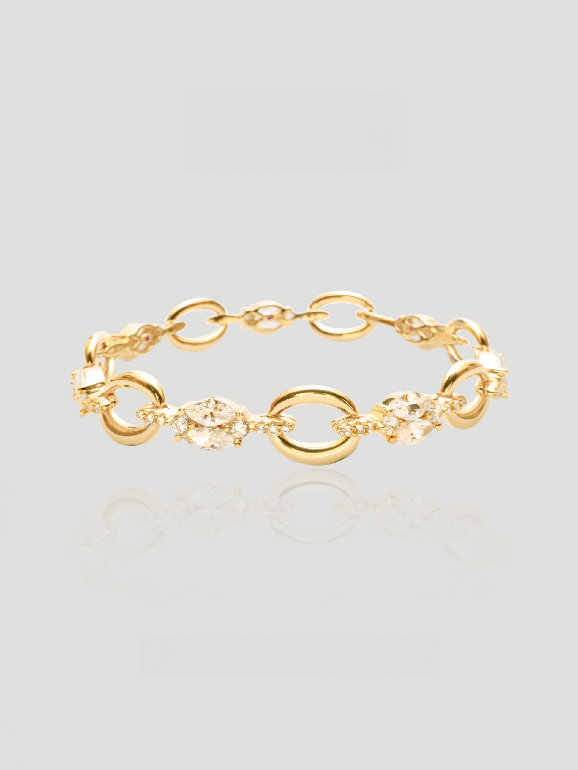 CARV. gold link bracelet with oval links, marquise crystal accents and delicate chain detail