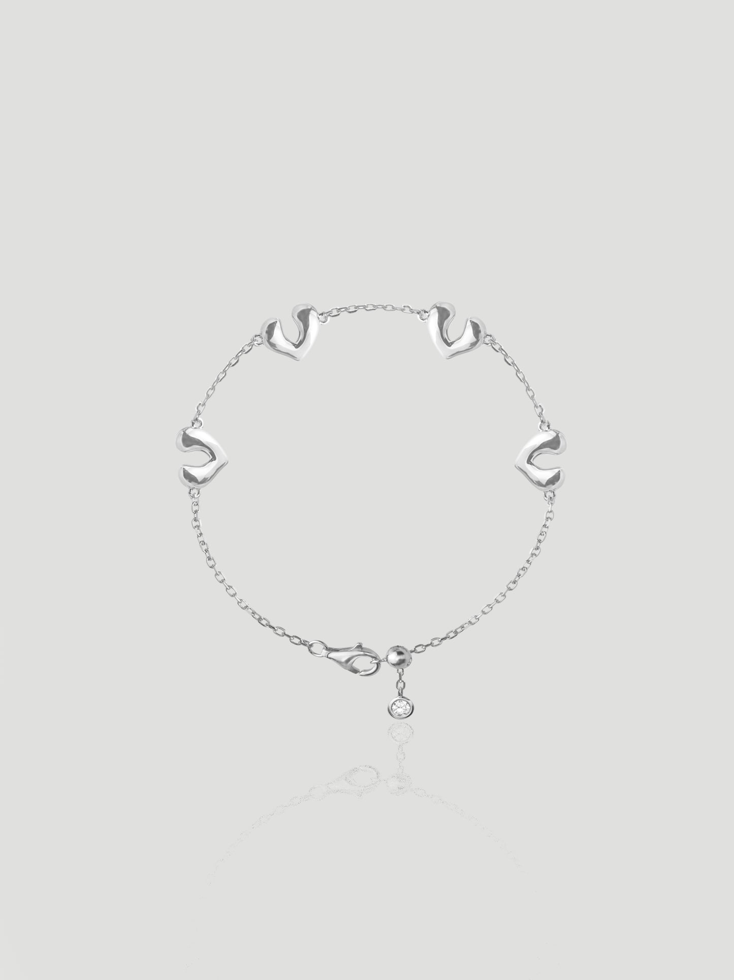 CARV. silver open heart charm bracelet with delicate chain links and a round drop charm