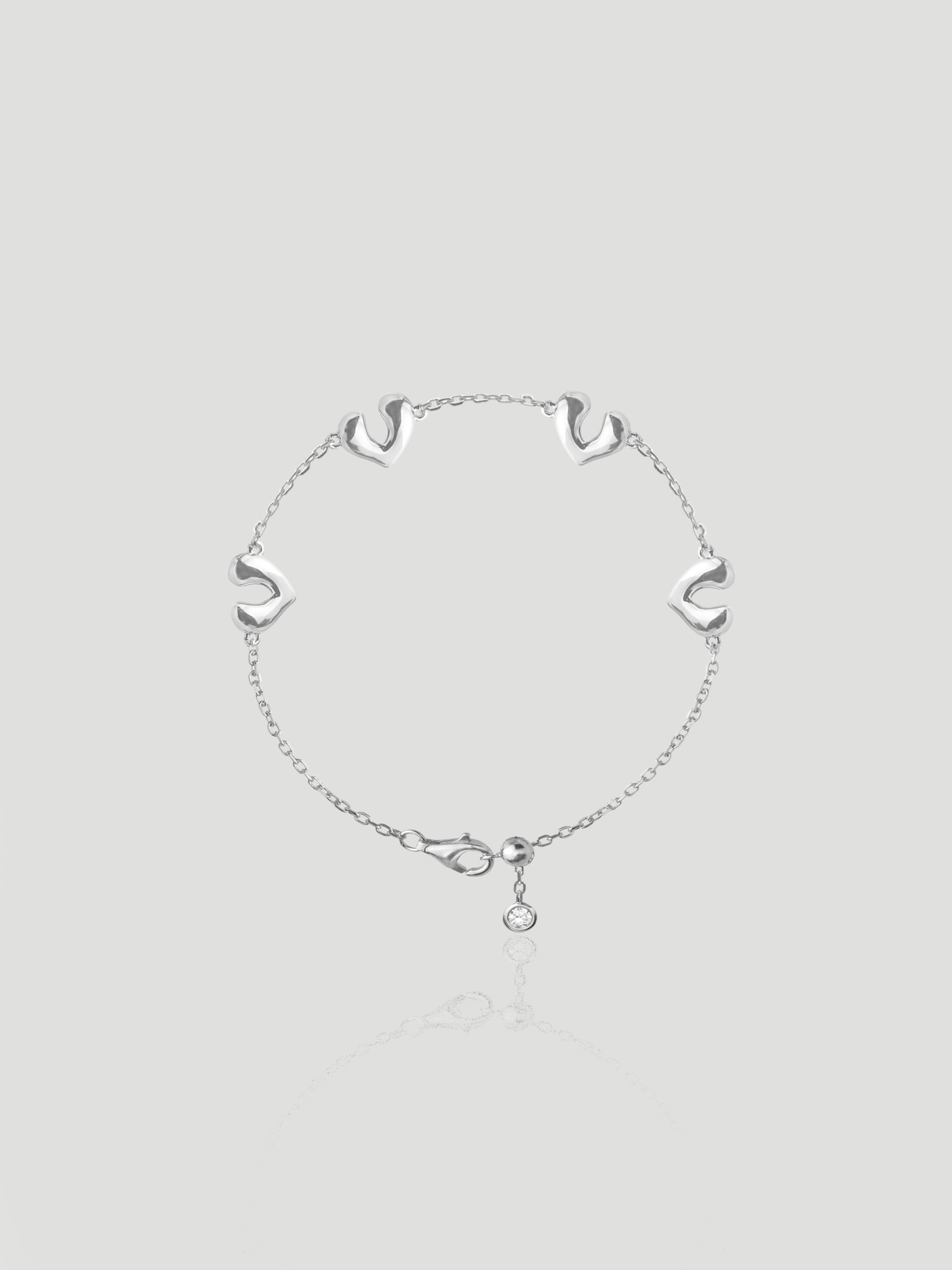 CARV. silver open heart charm bracelet with delicate chain links and a round drop charm