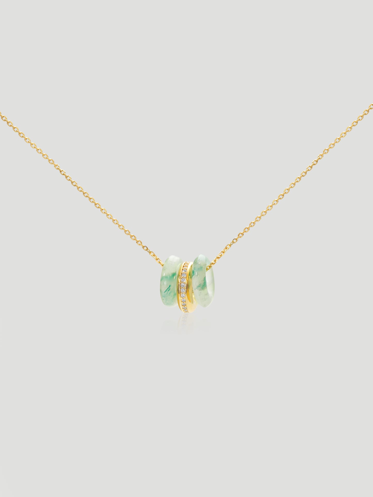 CARV. gold green stone orbit pendant necklace with triple hoop design and pavé center ring