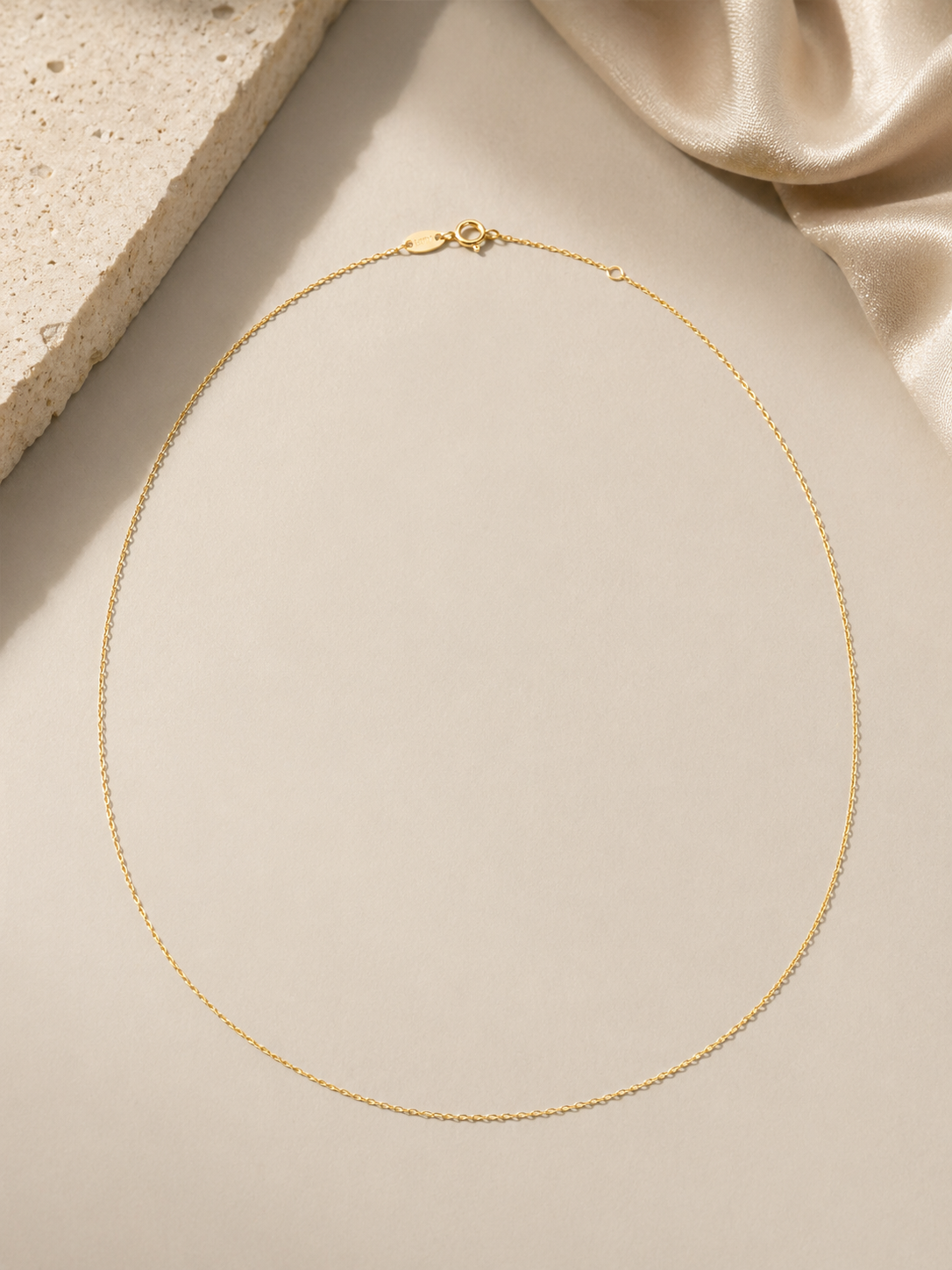 CARV. gold single chain necklace displayed flat with a fine minimalist chain and clasp detail