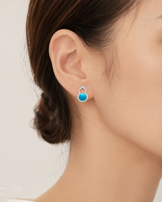 CARV. silver turquoise halo stud earrings worn on ear with round blue stone and pavé detail