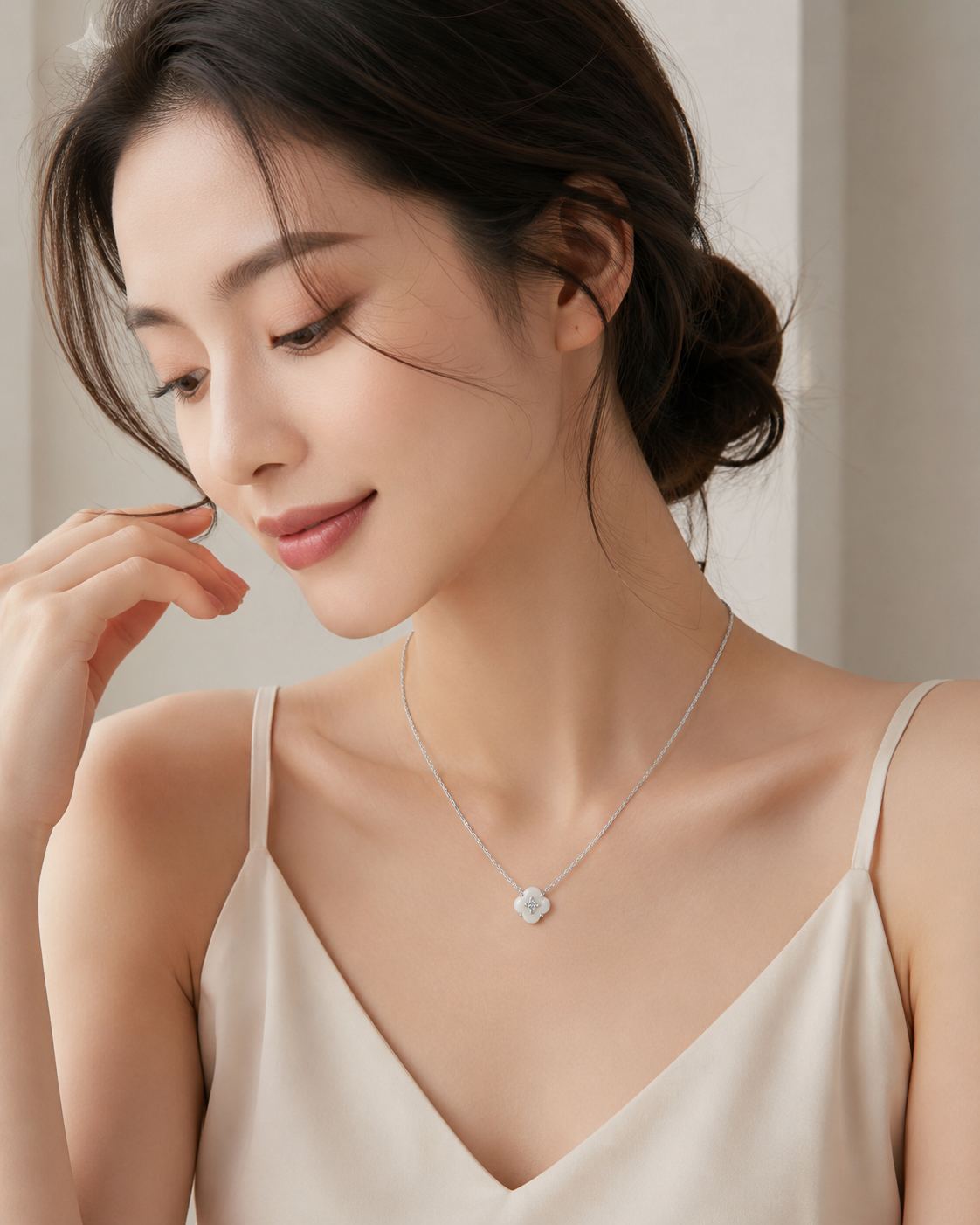 CARV. silver mother-of-pearl flower necklace worn on neck with white flower pendant