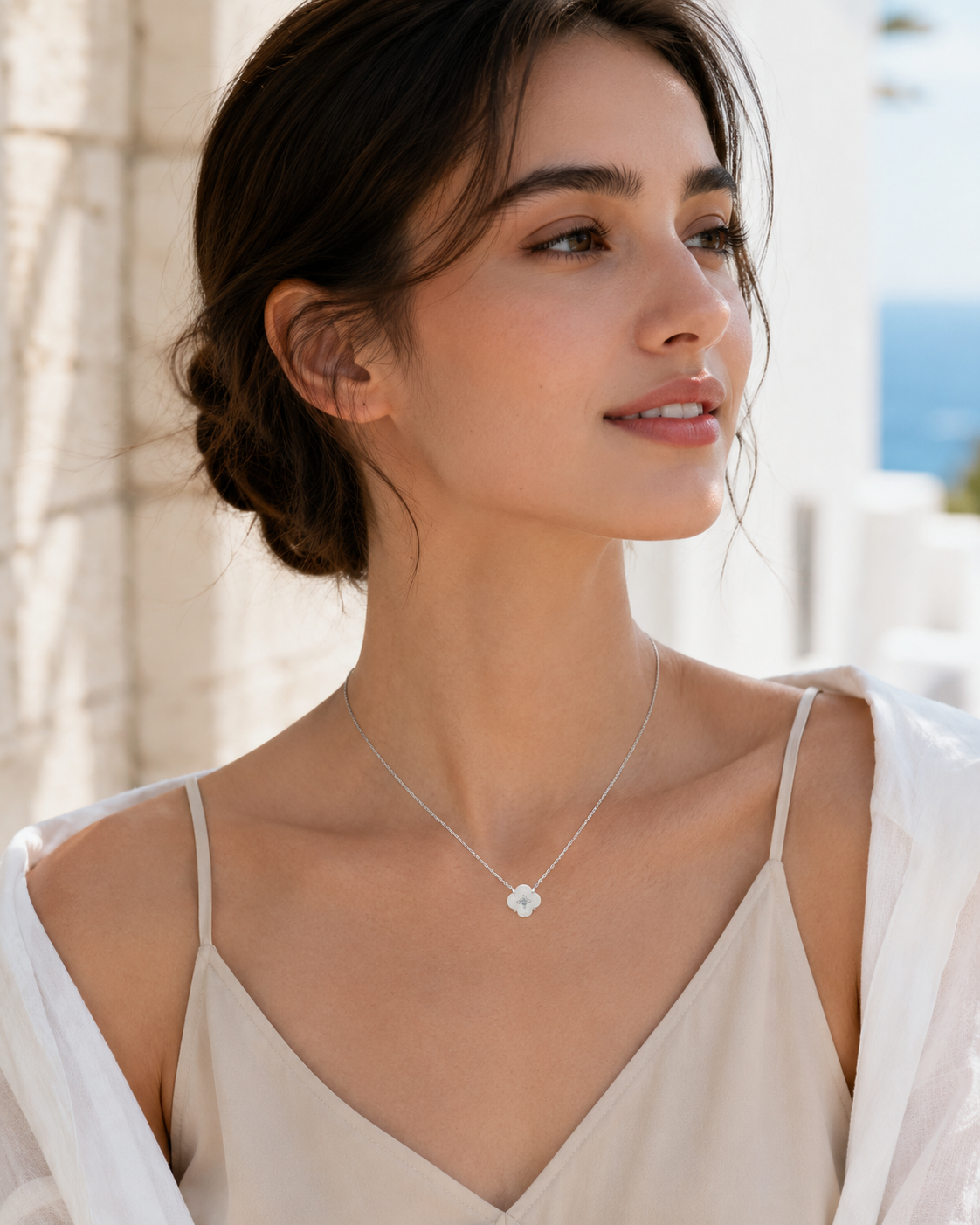 CARV. silver mother-of-pearl flower necklace worn on neck with floral pendant and crystal centre detail
