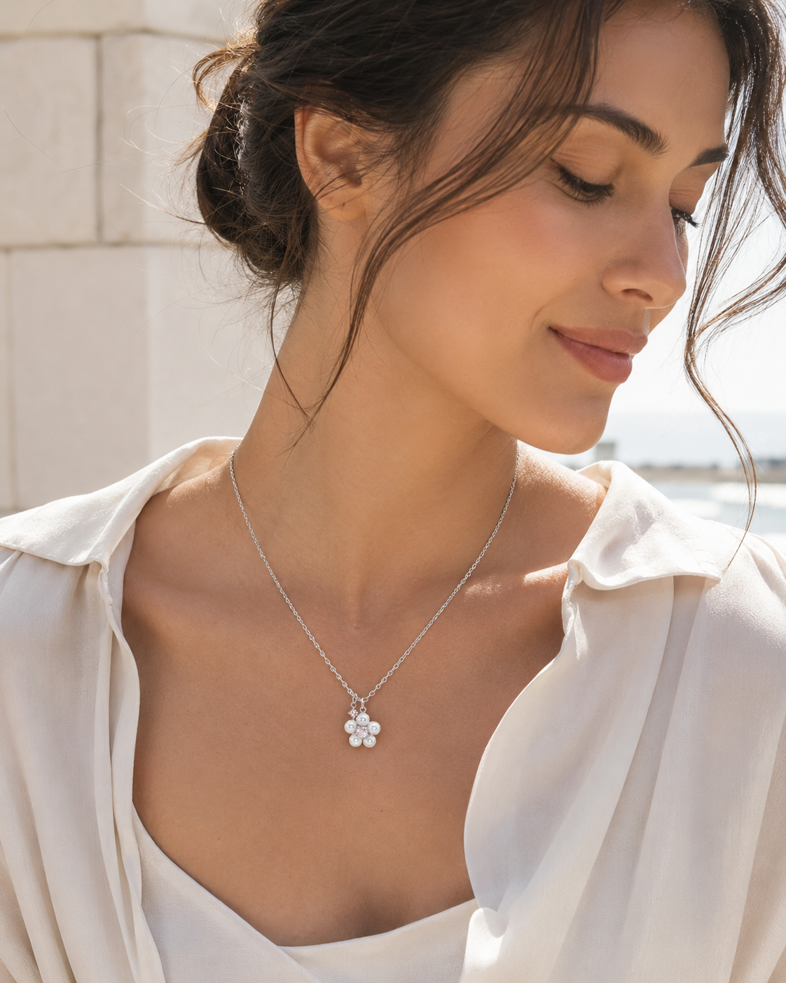 CARV. silver pearl cluster necklace worn at collarbone with small pearl bead pendant