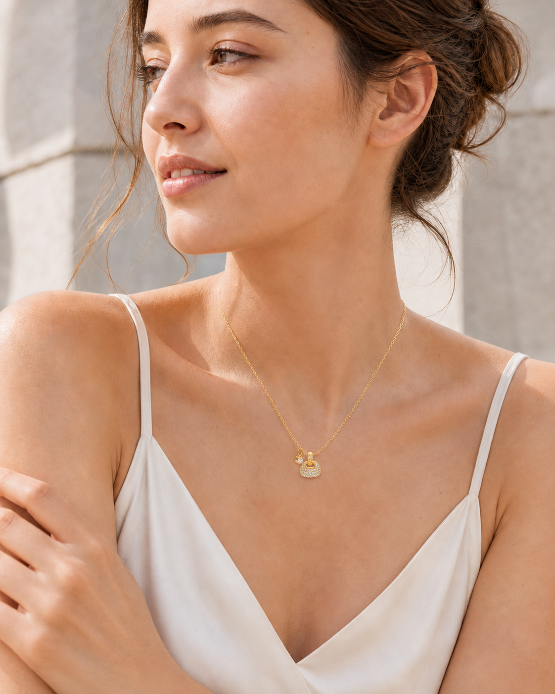 CARV. gold pavé dome pendant necklace worn at collarbone with round pavé pendant