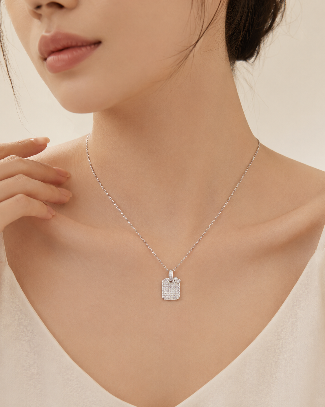 CARV. silver pavé square pendant necklace worn at collarbone with square crystal pendant