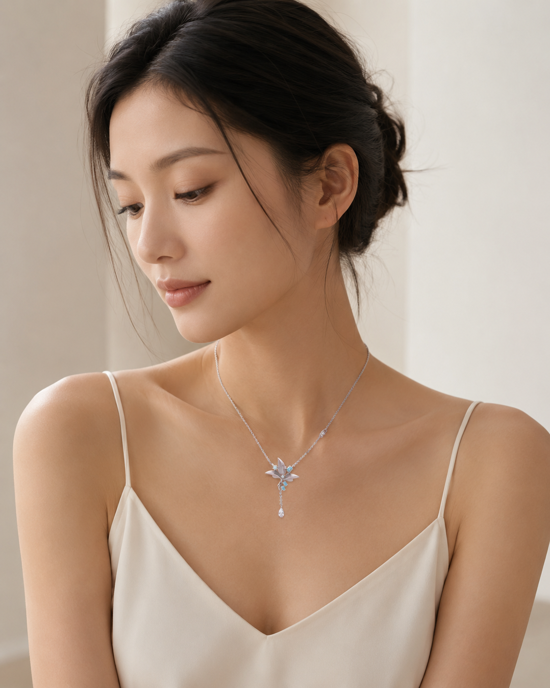 CARV. silver lily pendant necklace with turquoise accent worn with fine chain and tassel drop