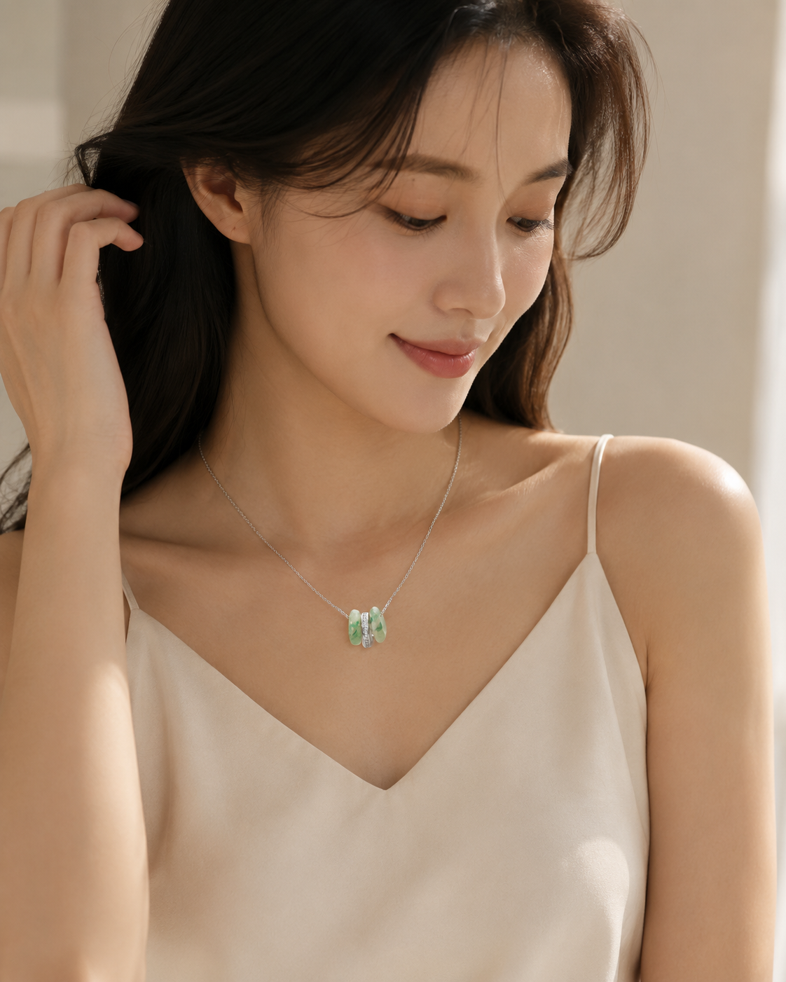 CARV. silver green stone orbit pendant necklace worn at collarbone with green stone pendant