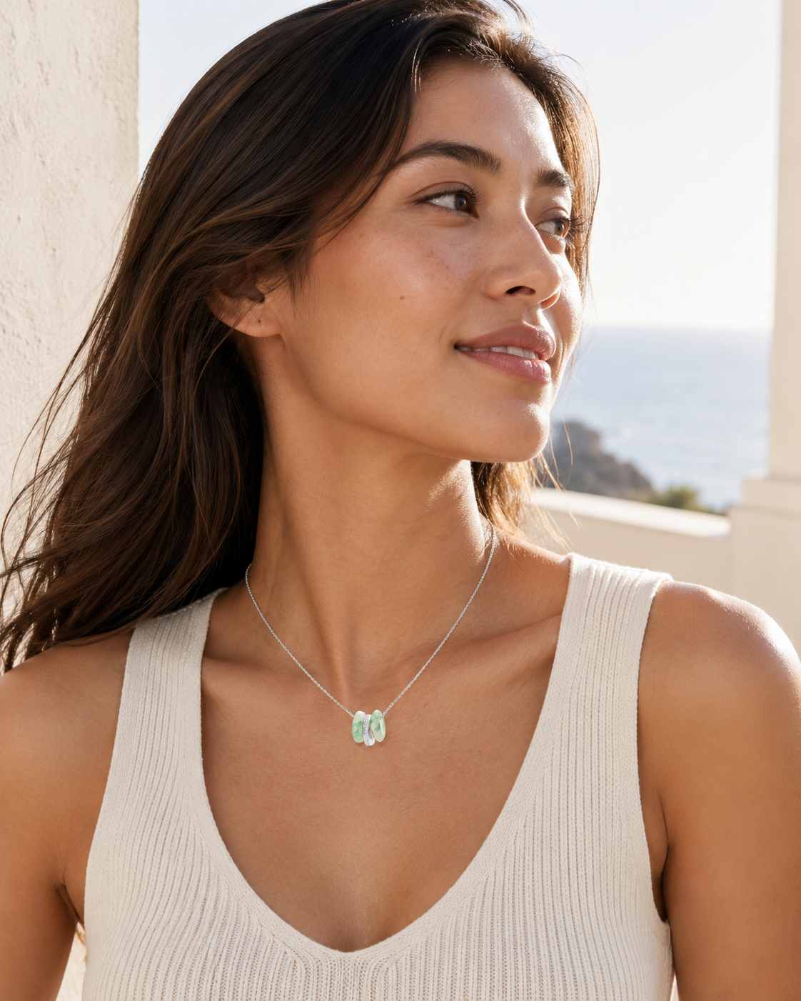 CARV. silver green stone orbit pendant necklace worn at collarbone with triple hoop design