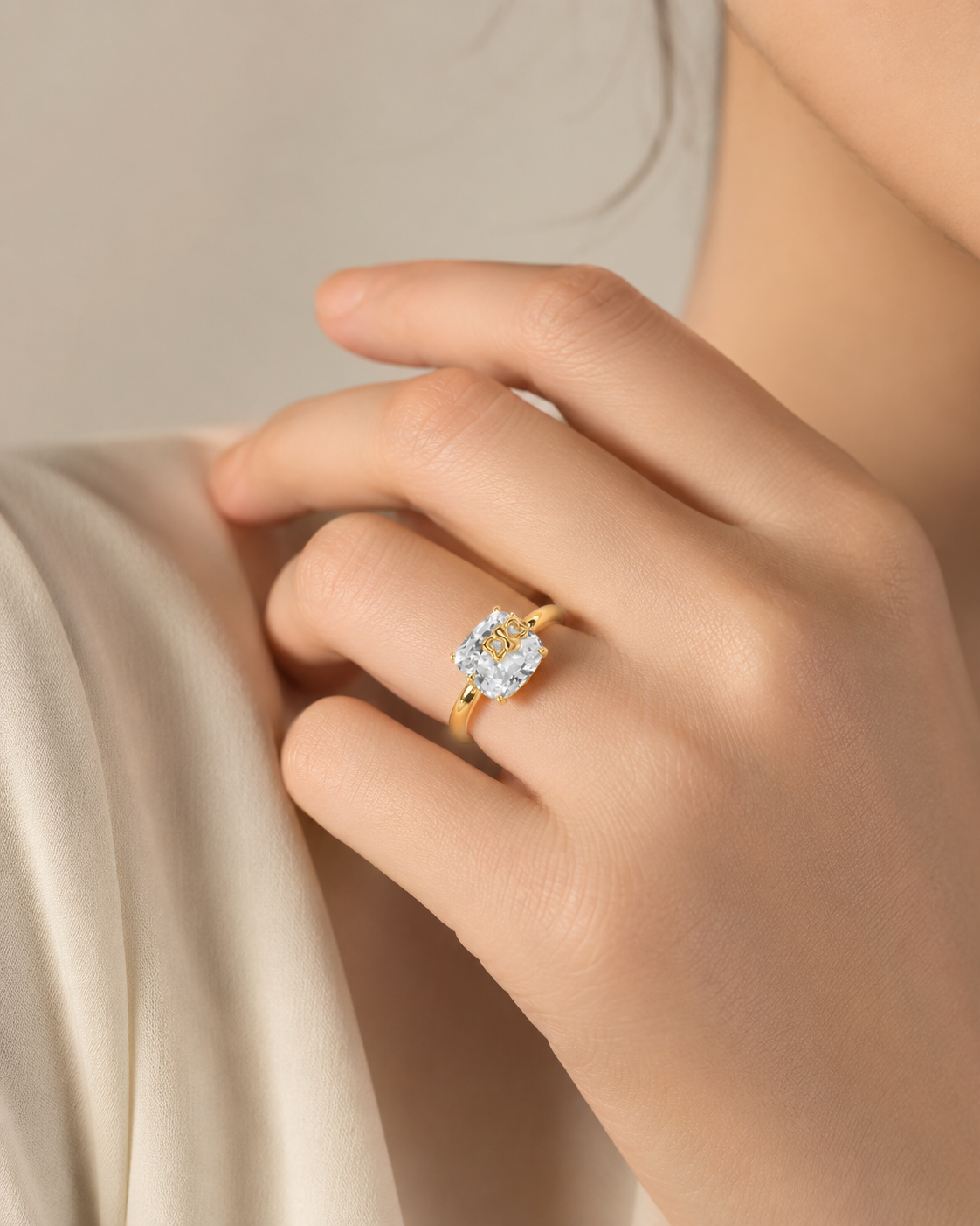 CARV. gold bow ring worn on hand for elegant everyday outfit styling