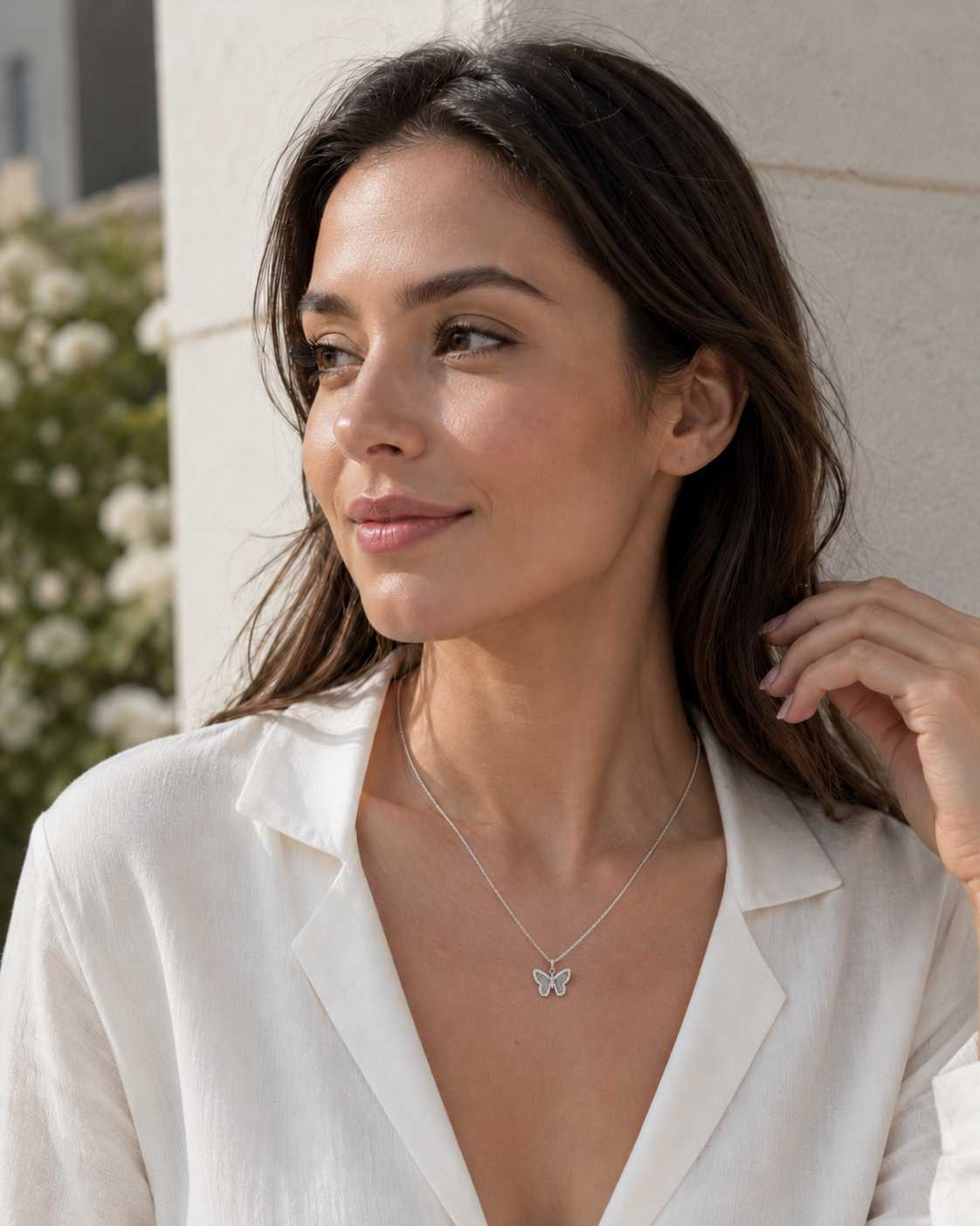 CARV. silver butterfly pendant necklace with pavé crystal butterfly charm worn at neckline