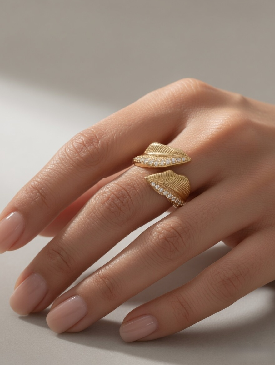 CARV. gold leaf open ring worn on hand with layered leaf design and pavé detail