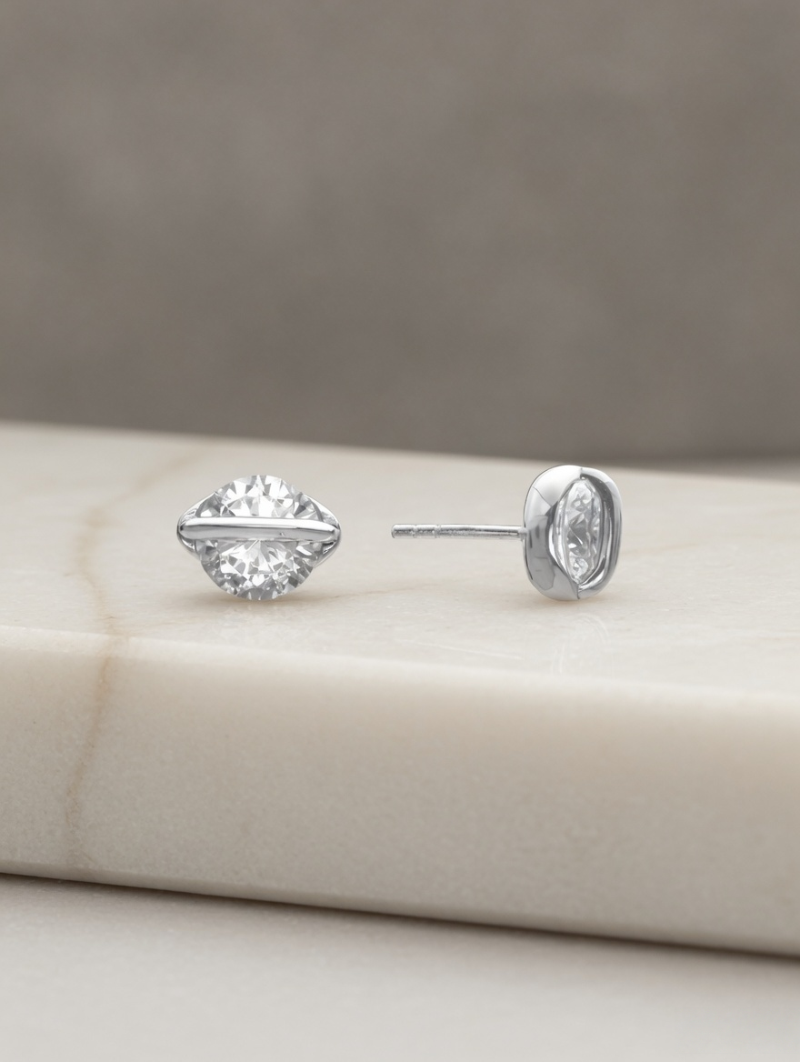 CARV. silver round crystal orbit stud earrings with bezel setting on display