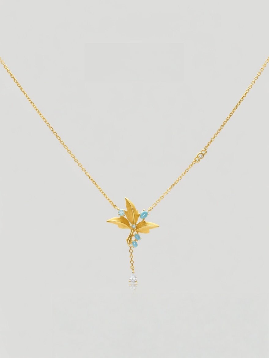 CARV. gold lily pendant necklace with turquoise accent, fine chain and delicate tassel drop