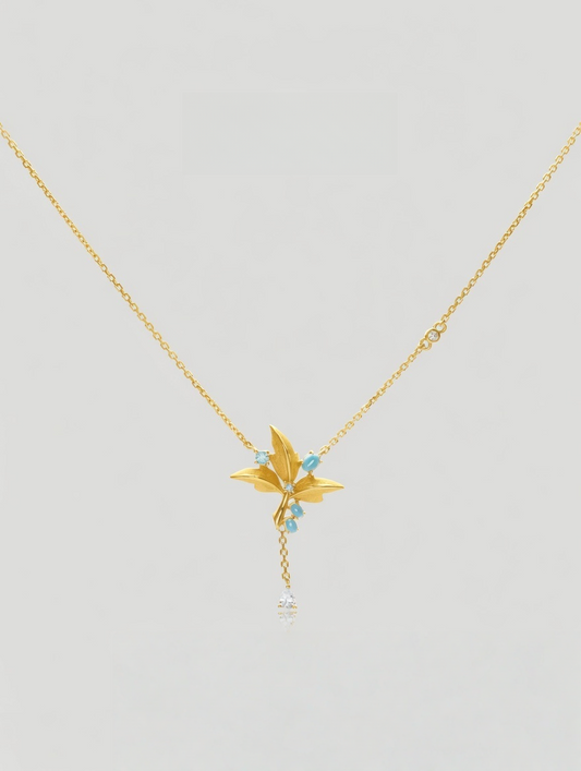 CARV. gold lily pendant necklace with turquoise accent, fine chain and delicate tassel drop