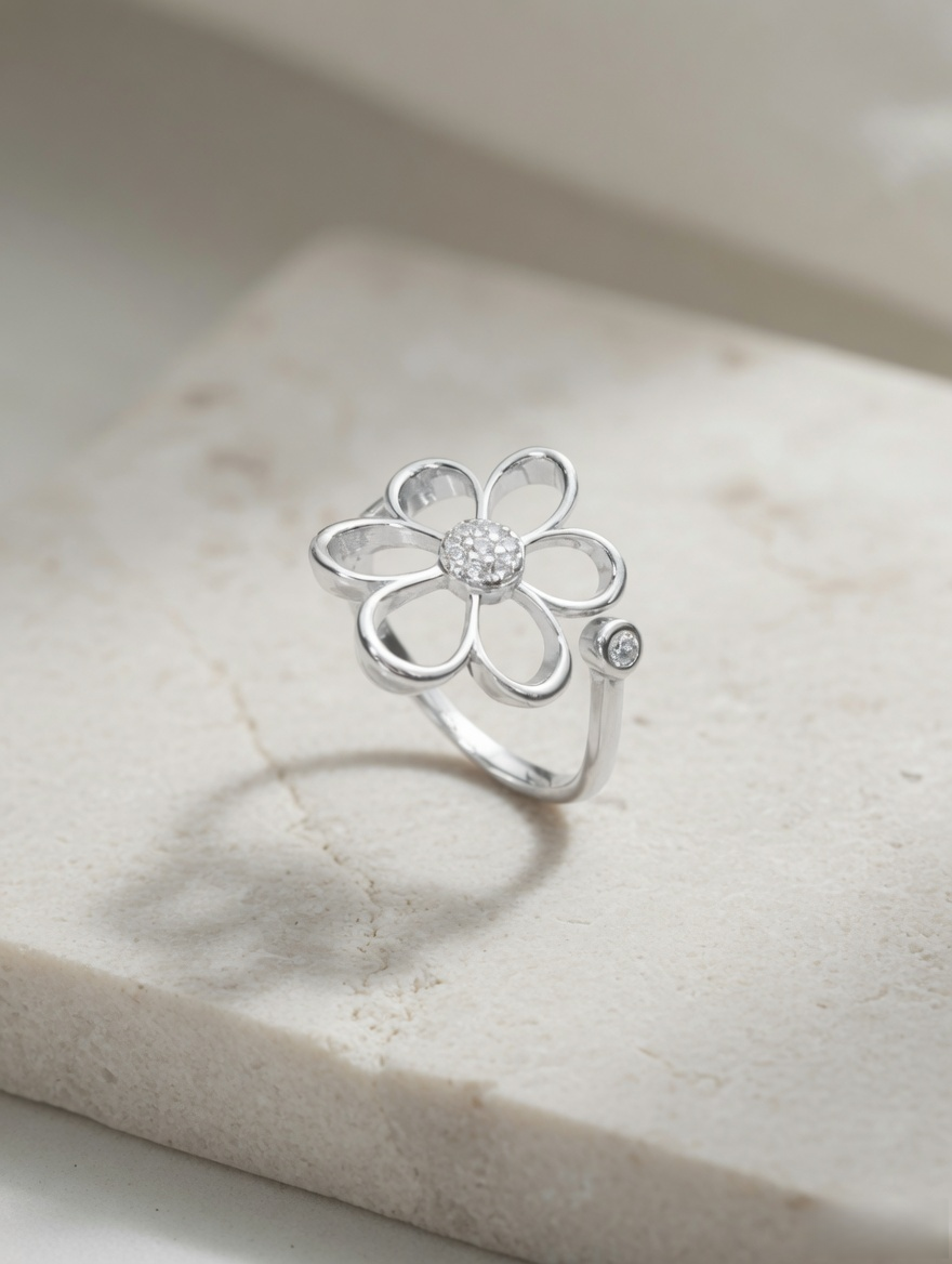 CARV. silver daisy flower ring with crystal center and open petal design studio close-up