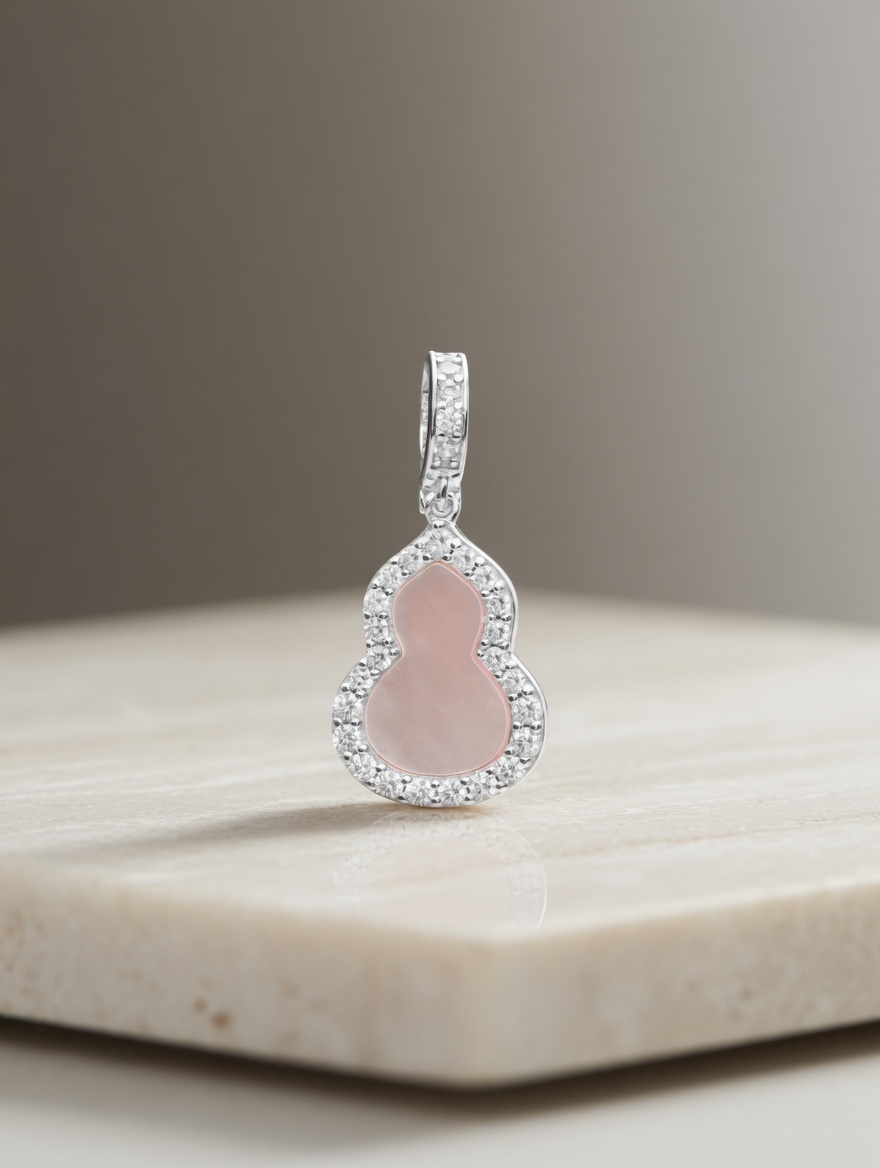 CARV. silver pink gourd pendant with pale pink stone, pavé halo setting and polished bail detail