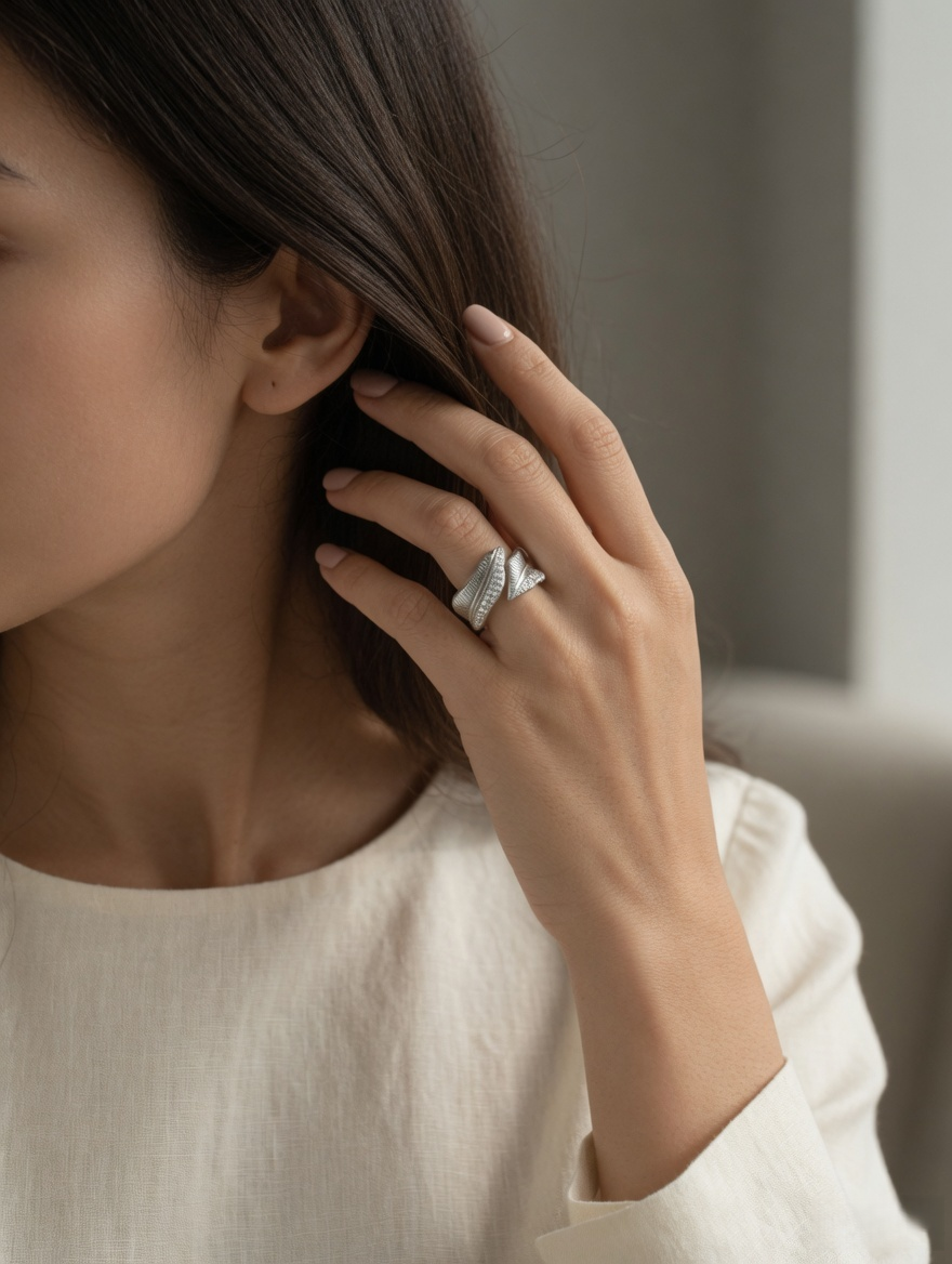 CARV. silver leaf open ring styled on finger with sculptural open band and leaf detail