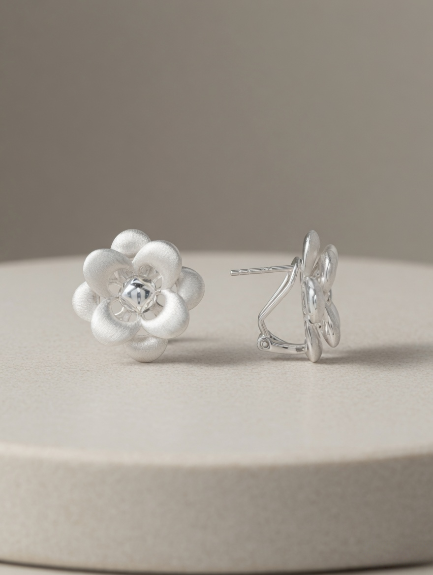 CARV. silver flower stud earrings with layered petal design and side view