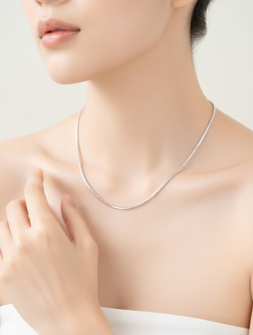 CARV. silver silk snake chain necklace worn on neck