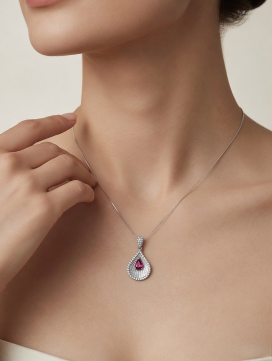 CARV. silver teardrop pendant necklace worn at collarbone with pink centre stone and pavé detail