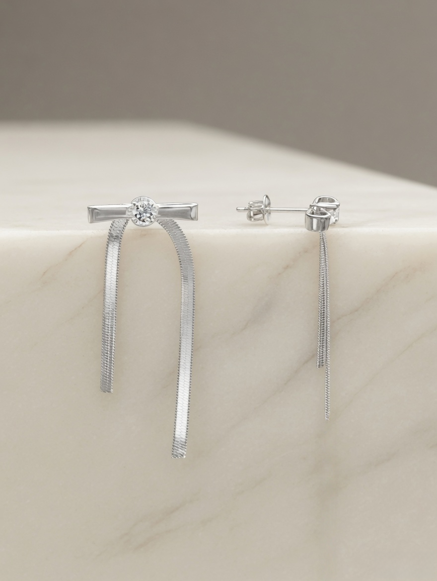 CARV. silver bar drop earrings with crystal studs and slim vertical drops on stone display
