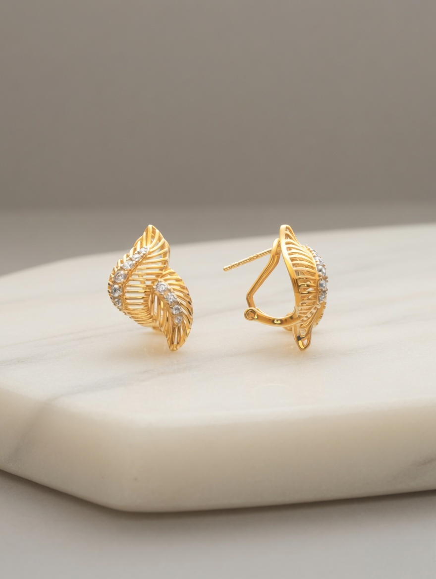CARV. gold leaf pavé stud earrings with layered leaf shape product display