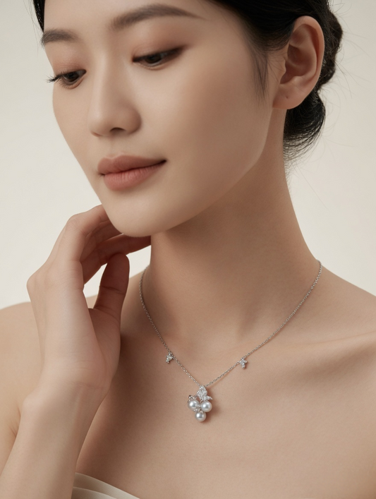 CARV. silver pearl cluster necklace with star chain detail and clustered pearl pendant worn on neck