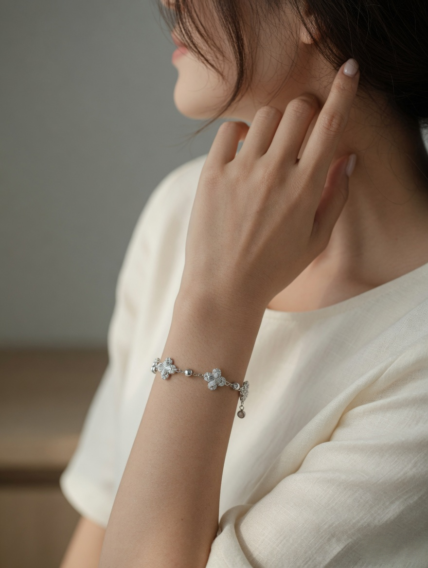 CARV. silver clover bracelet with crystal clover charms worn on wrist