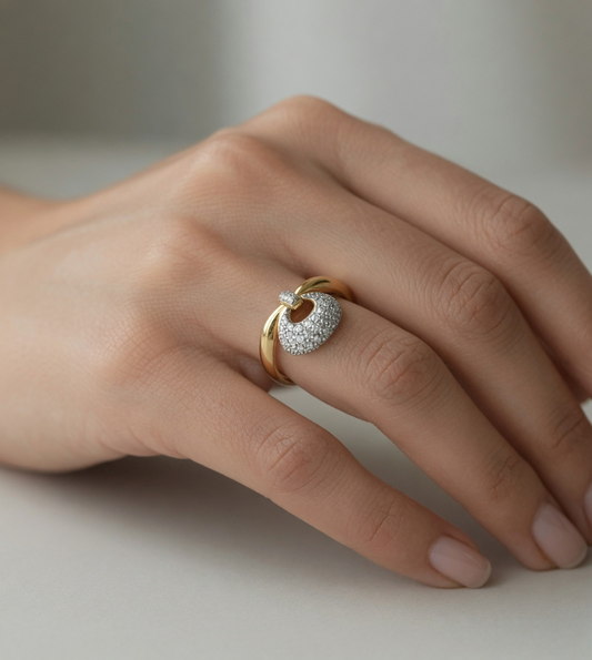 CARV. gold bag charm ring worn on hand with round charm shape and sparkling pavé detail