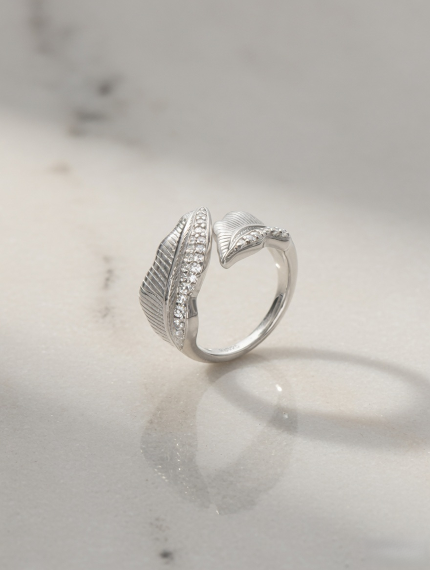 CARV. silver leaf open ring with sculptural band, layered leaf shape and pavé detail