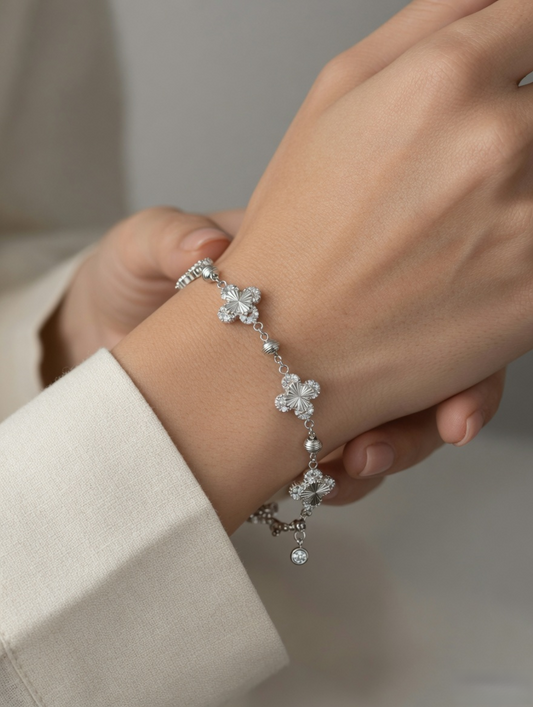 CARV. silver clover bracelet with crystal clover charms worn on wrist