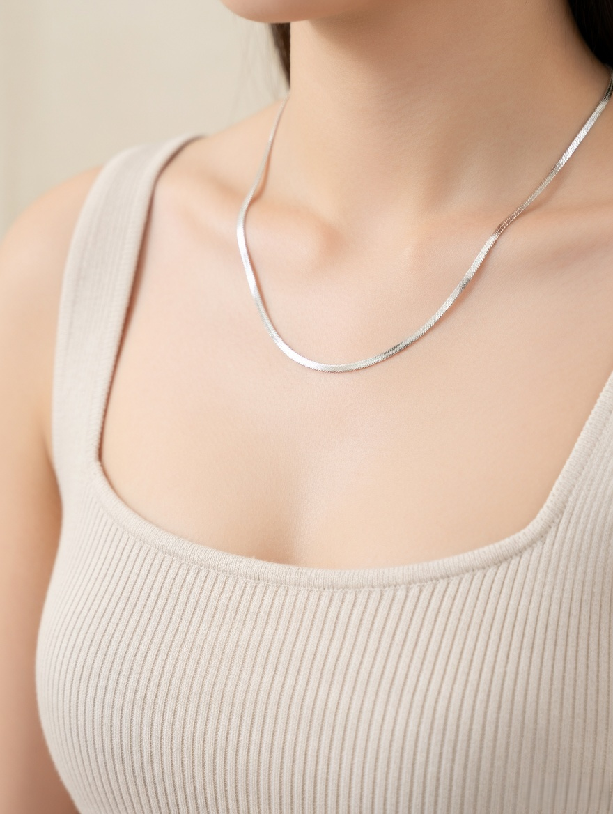 CARV. silver silk snake chain necklace worn on neck