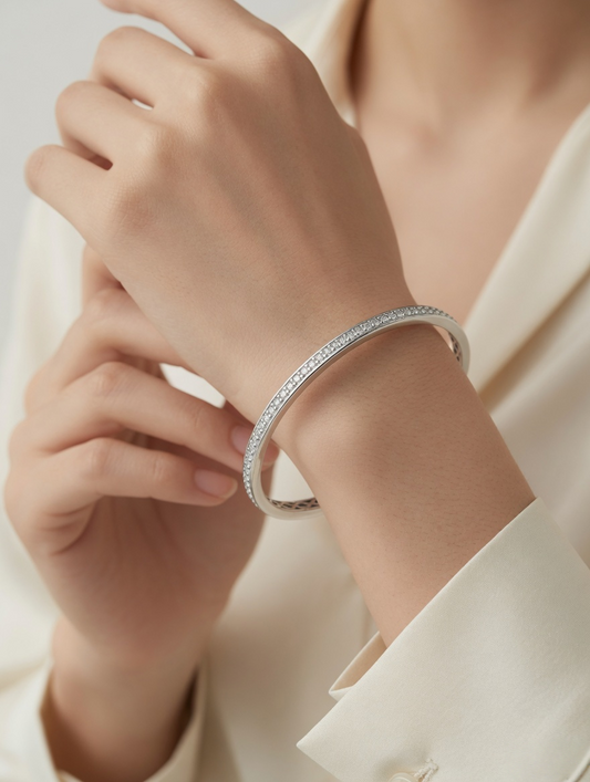 CARV. silver open cuff bangle with slim curved shape and pavé detail worn on wrist