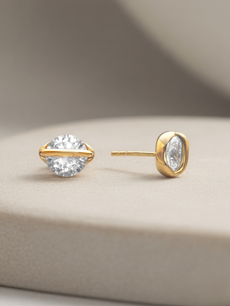 CARV. gold round crystal orbit stud earrings with bezel setting on display