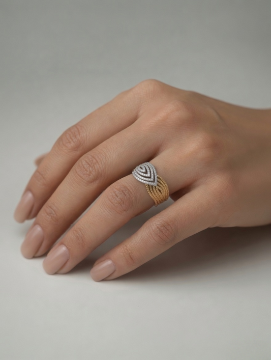 CARV. two-tone pavé crossover ring worn on hand with ribbed band and silver pavé centre detail
