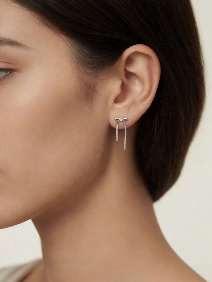 CARV. silver bar drop earrings worn on ear with crystal stud and slim vertical drop detail